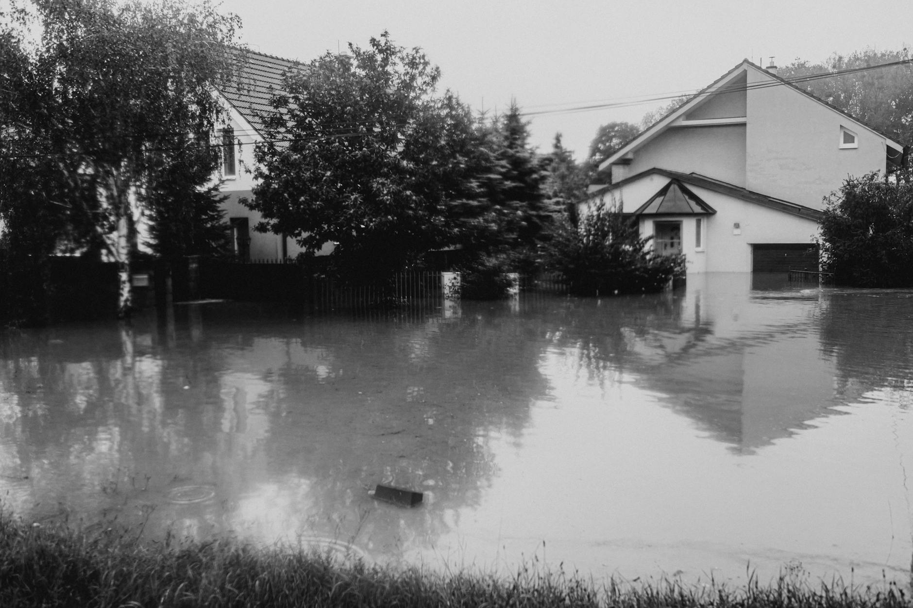 flooded neighborhood street with submerged houses