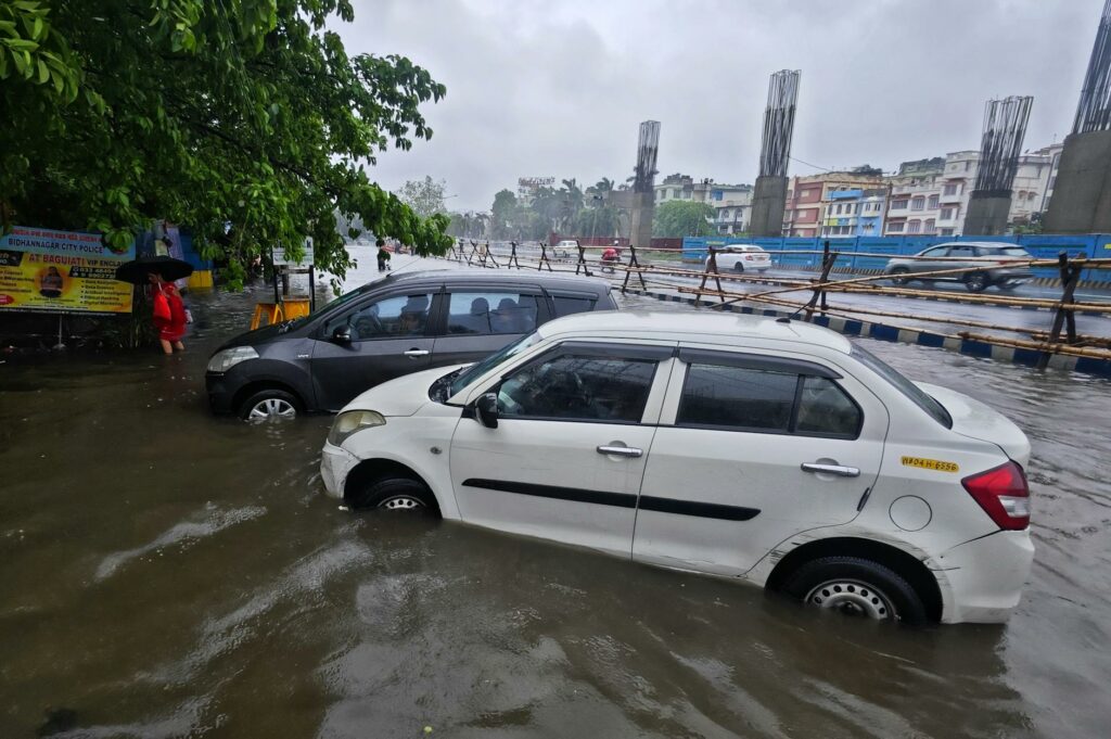 cars on street in water during flood