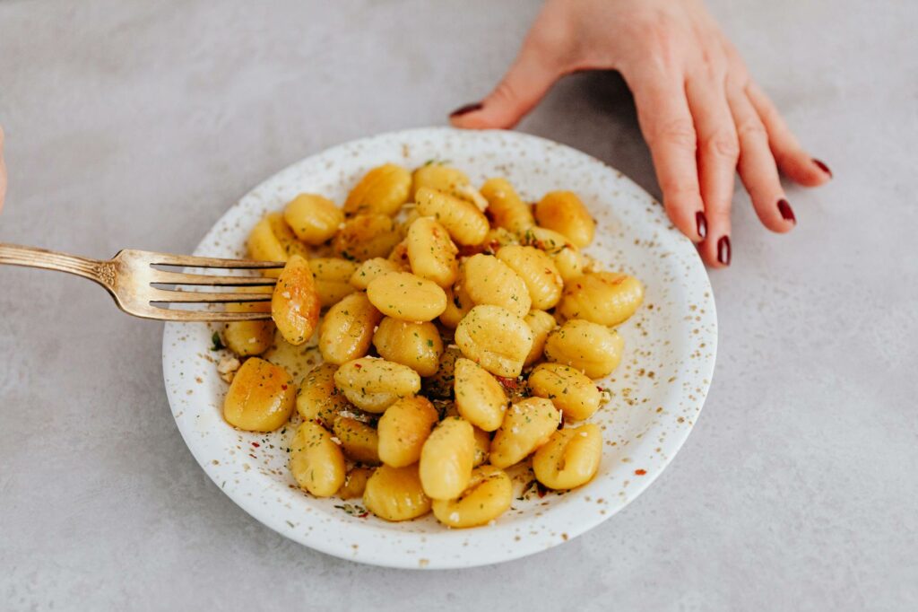 a gnocchi on a ceramic plate